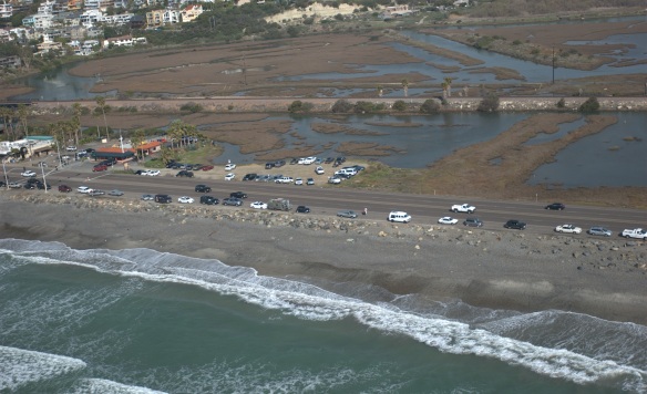 Wave information, both real-time and historical, helps engineers assess best options for coastal infrastructure, such as roads and popular beachfront properties. Above, the historic Highway 101 passes through a low point between the Pacific Ocean and San Elijo Lagoon at Cardiff, CA. Coastal roads such as these are vulnerable to storm surge and higher waves (photo courtesy of CDIP).  